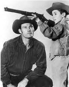Chuck Connors photo: Chuck Connors, Johnny Crawford, April 1958 jc195804_AIMSrifle.jpg