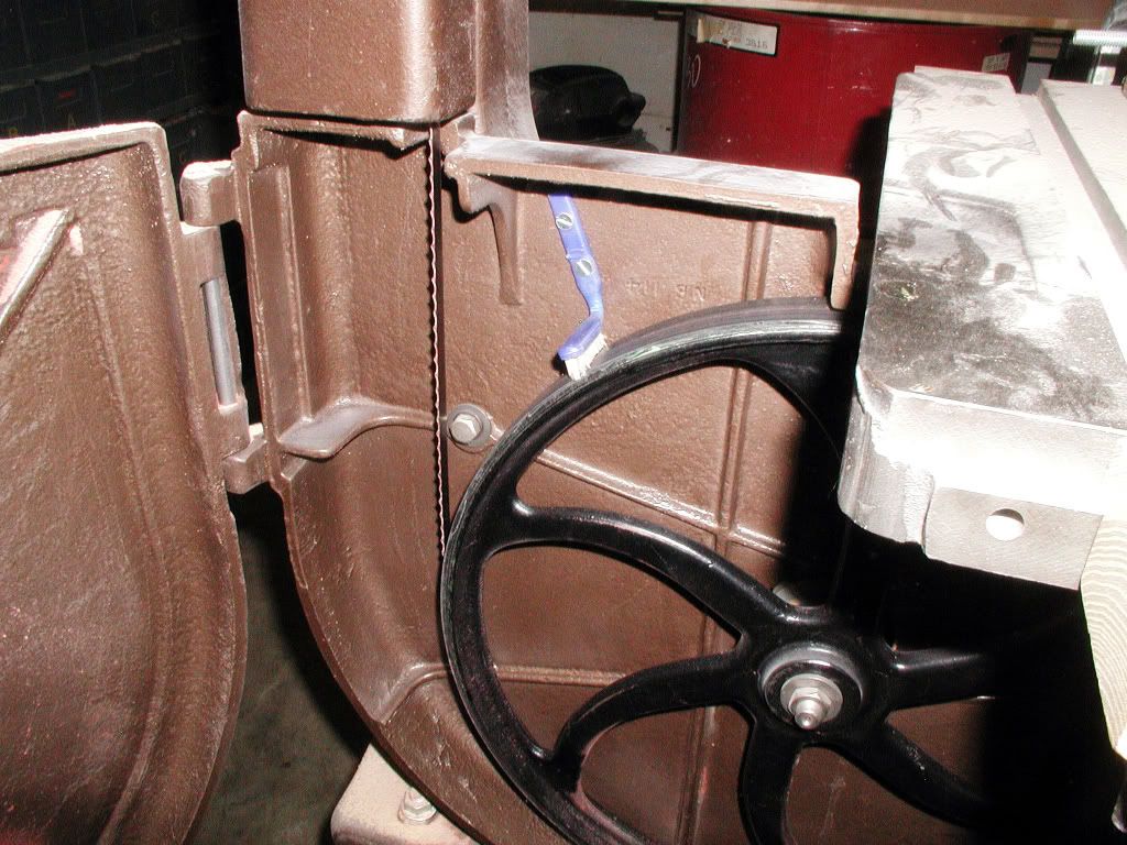 Mounting brush on lower bandsaw wheel?